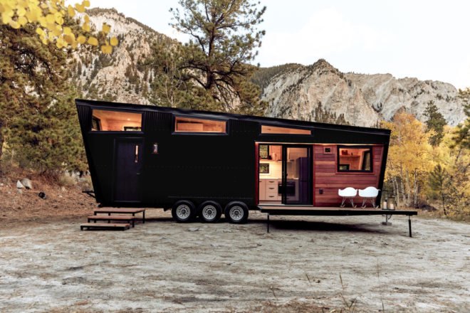 black RV with windows and front deck