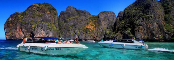 several tourist boats in Maya Bay