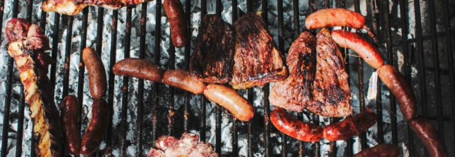 variety of meat on a grill