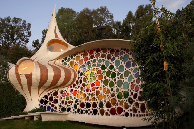 seashell-shaped home with colorful glass facade