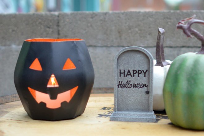 Black Jack O'lantern with candle inside on table