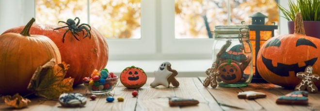 cookies, glass jars and pumpkins on a table