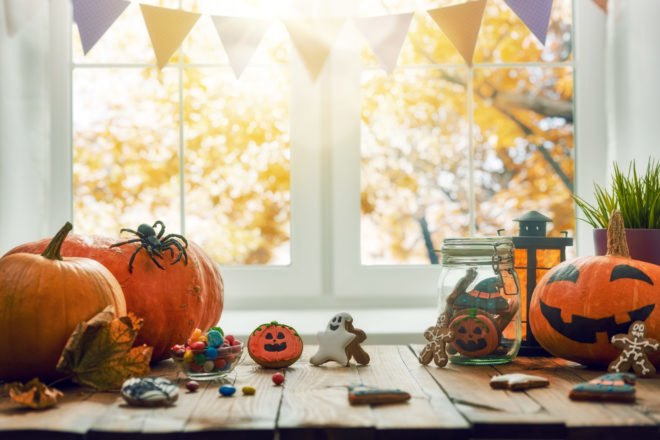 cookies, glass jars and pumpkins on a table