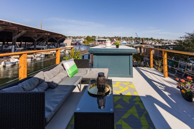 an outdoor space with gray sectional