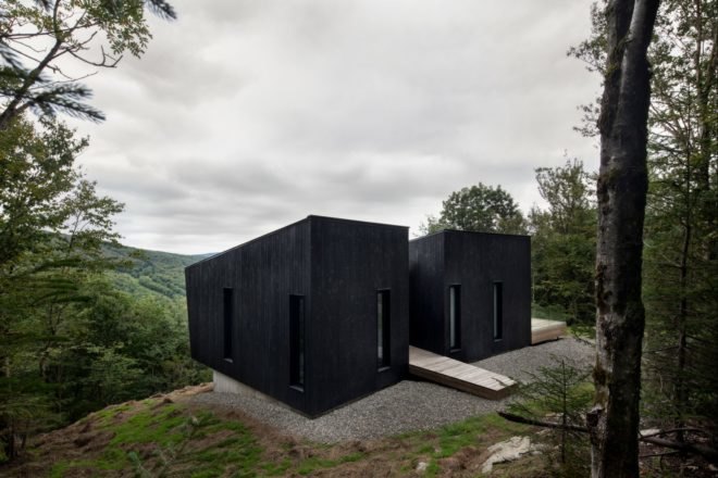 two black cabins with middle walkway