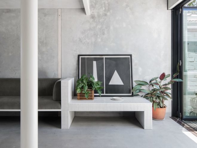 living room space with tiled bench