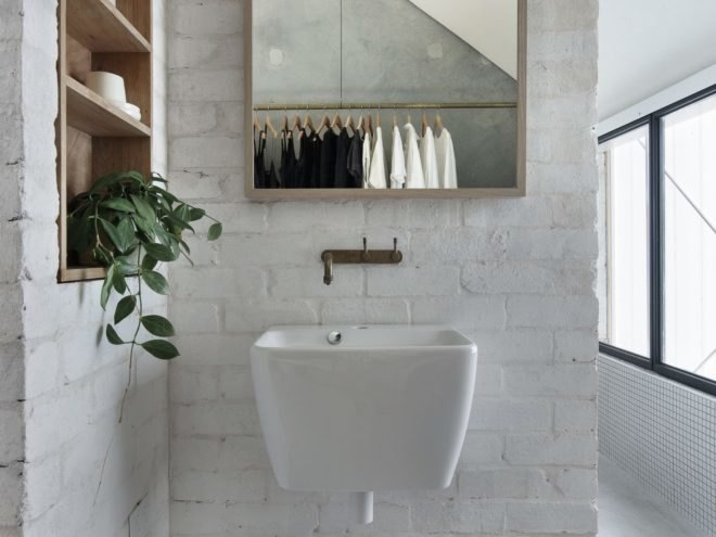 bathroom with white sink and mirror