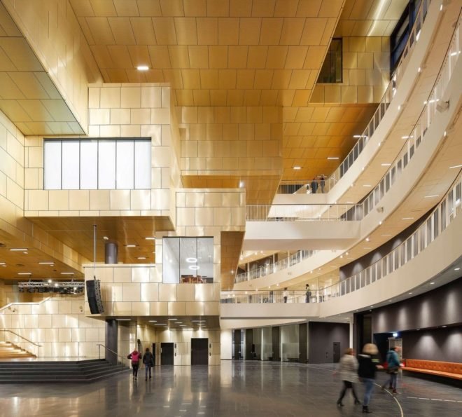 gold and white building with several floors