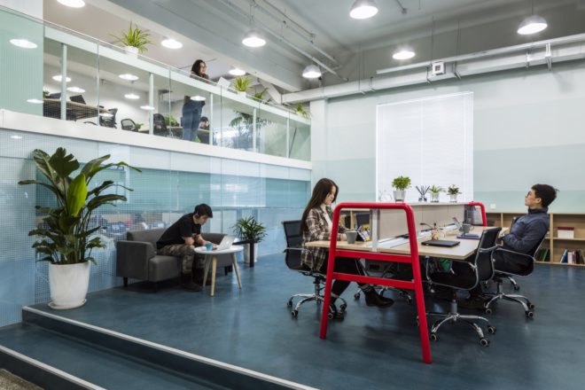 people at a desk in an office
