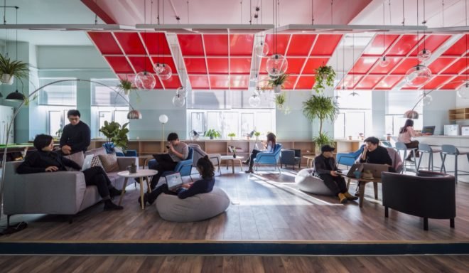 people sitting on couches and in bean bag chairs