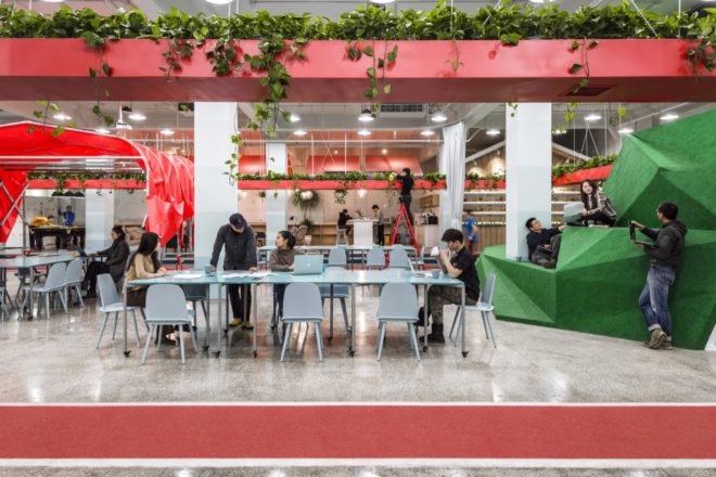 white and red office with tall geometric green volume