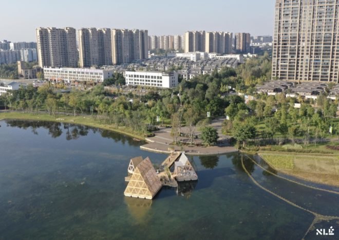 aerial view of triangular wood structures floating on water