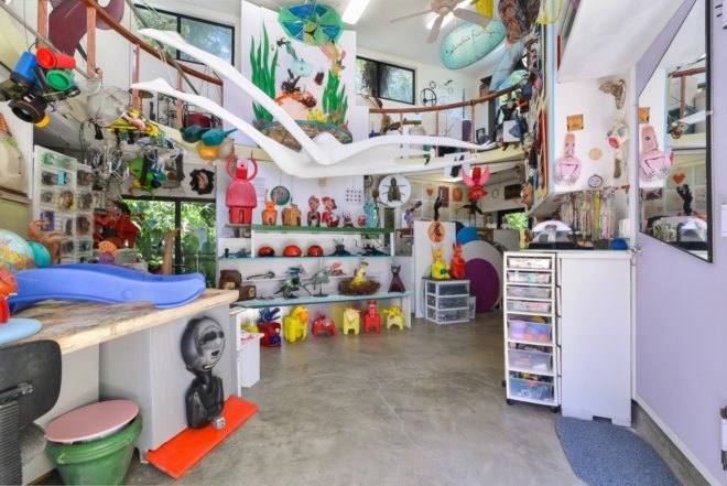 white room filled with colorful artwork