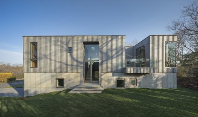 gray home on grassy lot during the day