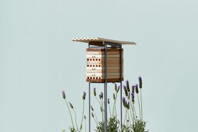 small wood shelter with blue background