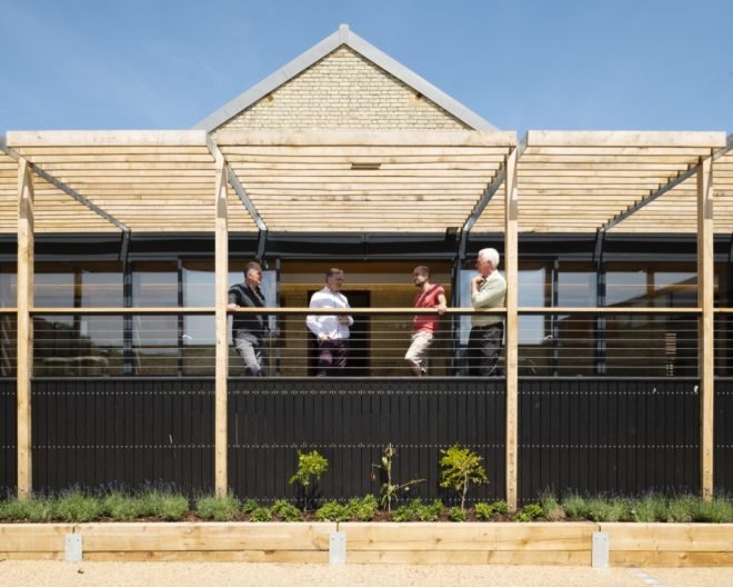 people standing on a deck and chatting