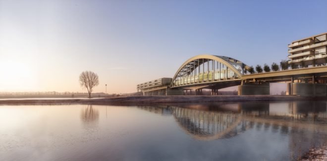 rendering of bridge with apartments underneath at sunset