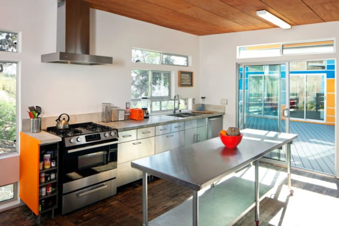 white kitchen with steel cabinets and energy-efficient appliances