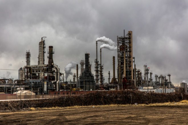 oil refinery factory under gloomy gray skies