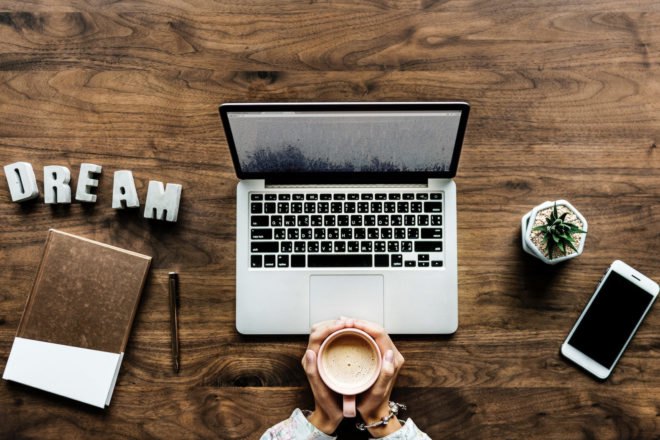 aerial view of laptop, notebook, cellphone and coffee