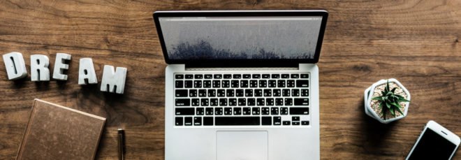 aerial view of laptop, notebook, cellphone and coffee