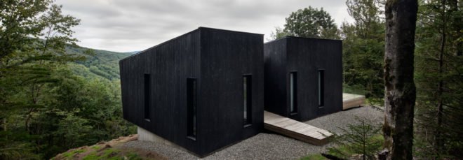 two black cabins with middle walkway