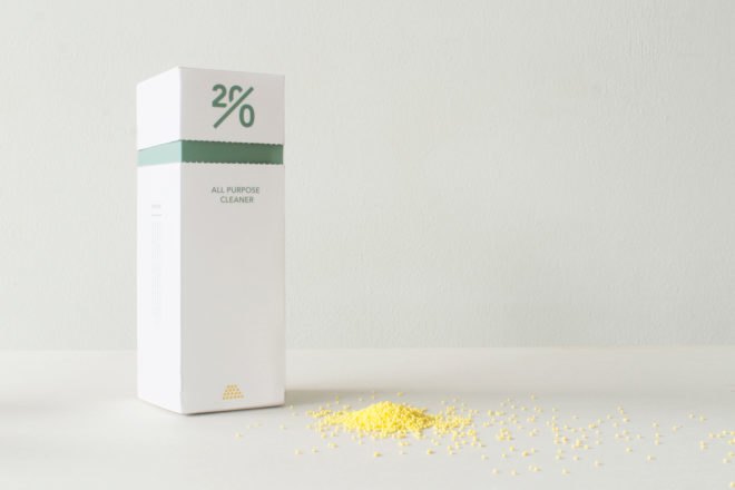 yellow cleaning beads near green and white box