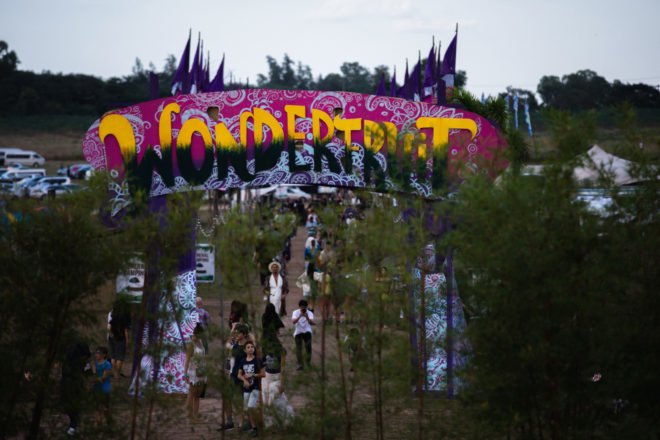 colorful sign that reads "Wonderfruit"