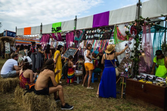 people shopping at art vendors