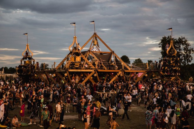 crowds of people around intricate stages