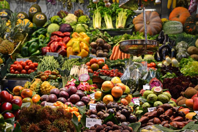 fruits and vegetables at a market stand