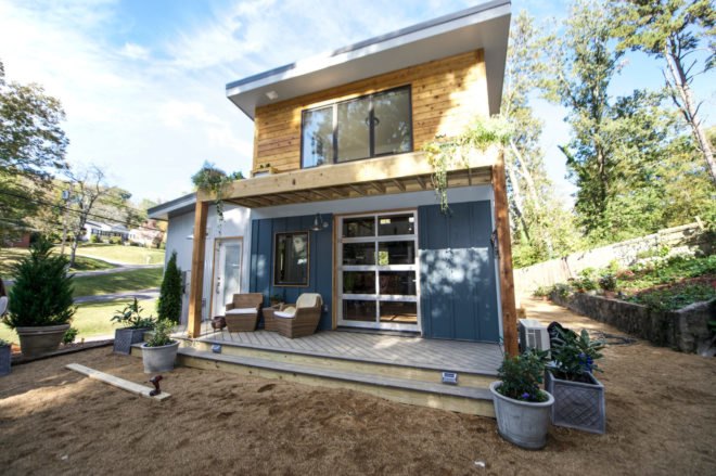 yellow and blue home with front porch