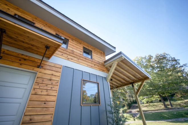 cedar home with blue highlights