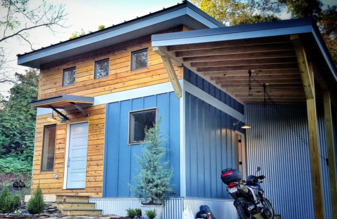 yellow and blue home with front porch