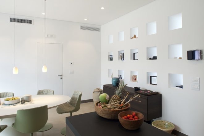 interior of home with white walls and dark wood tables