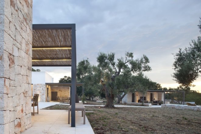 exterior view of patio area with trees and gazebo
