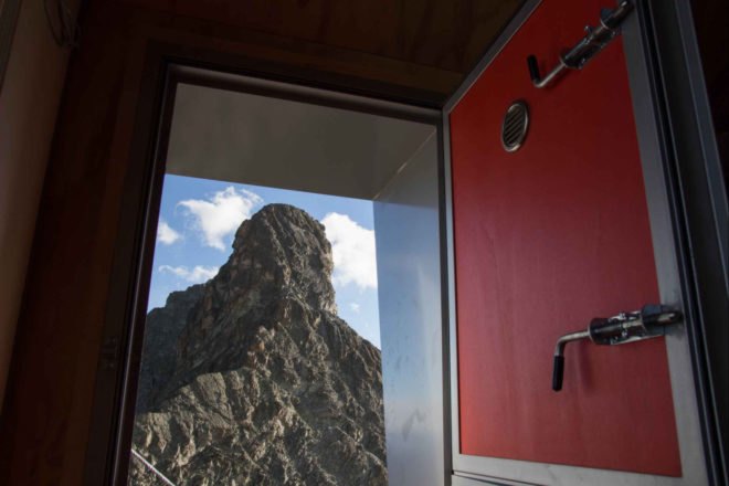 open door with views of mountain peak