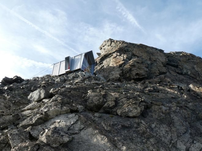 metal shelter on mountain ridge
