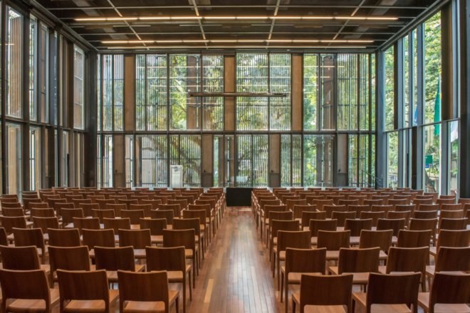 auditorium with wood seats and glass walls