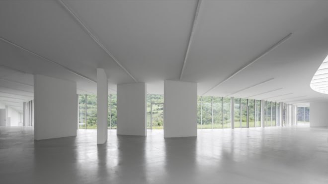 all-white room with glass walls