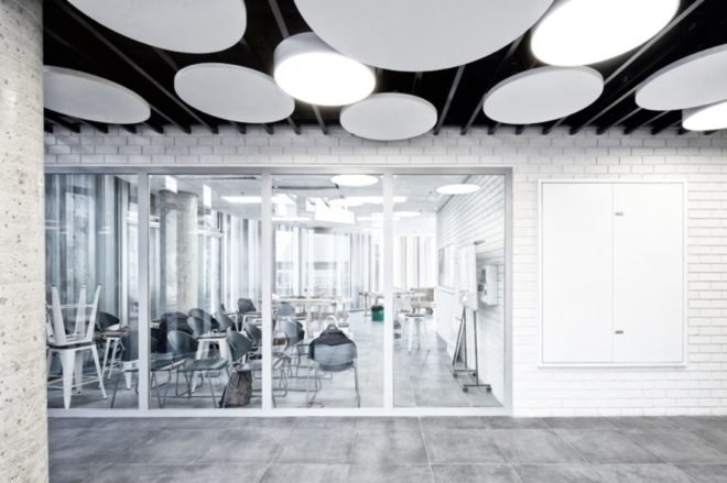 Light illuminates a white office space with plenty of light