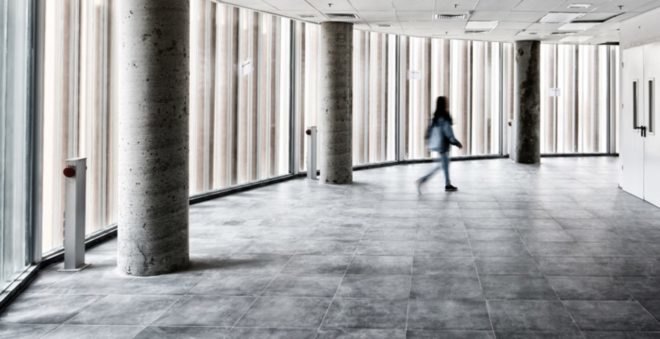 Person walks throughout open space inside ECO-TUBES building