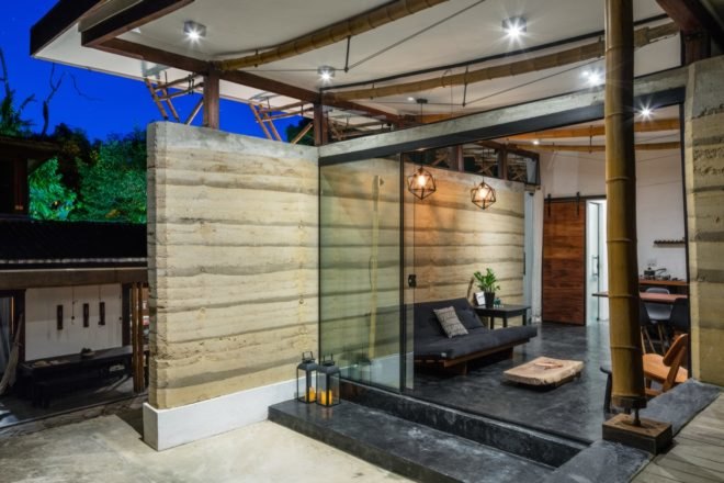 living room with glass wall open to the outdoors