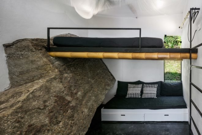 bunk bed above small sofa