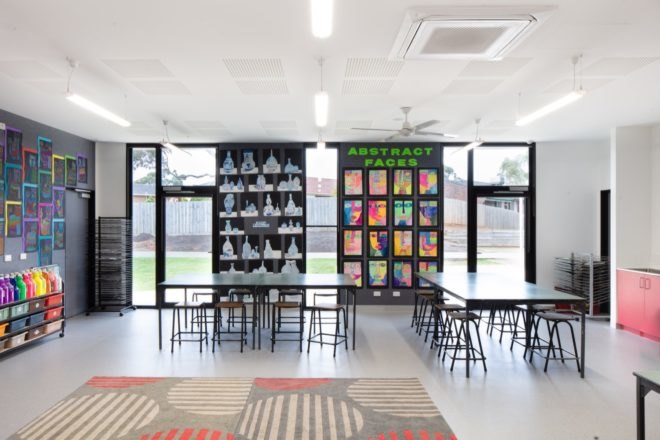 classroom with colorful art on walls