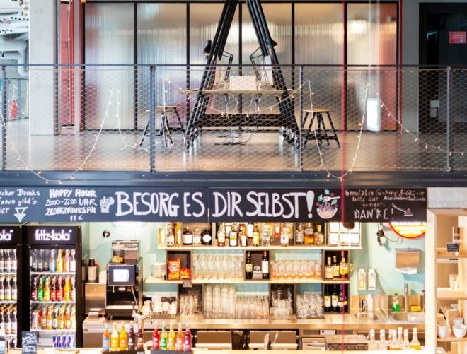 a cafe on one level with dining areas on the top level