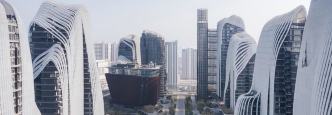 village-like mixed-use development between skyscrapers in city