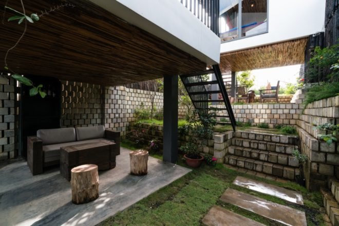 recreational area underneath property with couch and garden