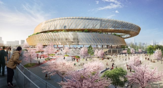 cherry blossom trees surround the outside of the wellness hub in a rendering