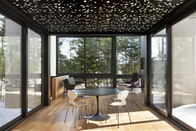 dining area with wood floors and aluminum suspended ceiling